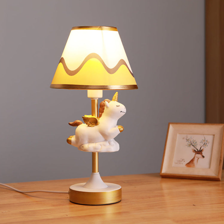 Twinkle Horn – A unicorn table lamp with a fabric shade, perfect for a study room