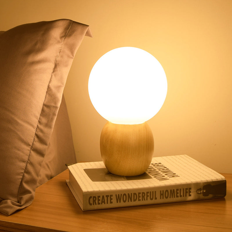 Nuvola – an elegant frosted ball lamp with an organic wood base