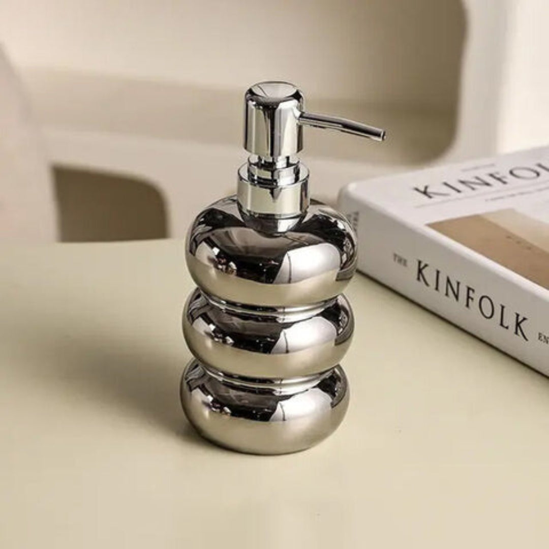 Ceramic dispenser with pump