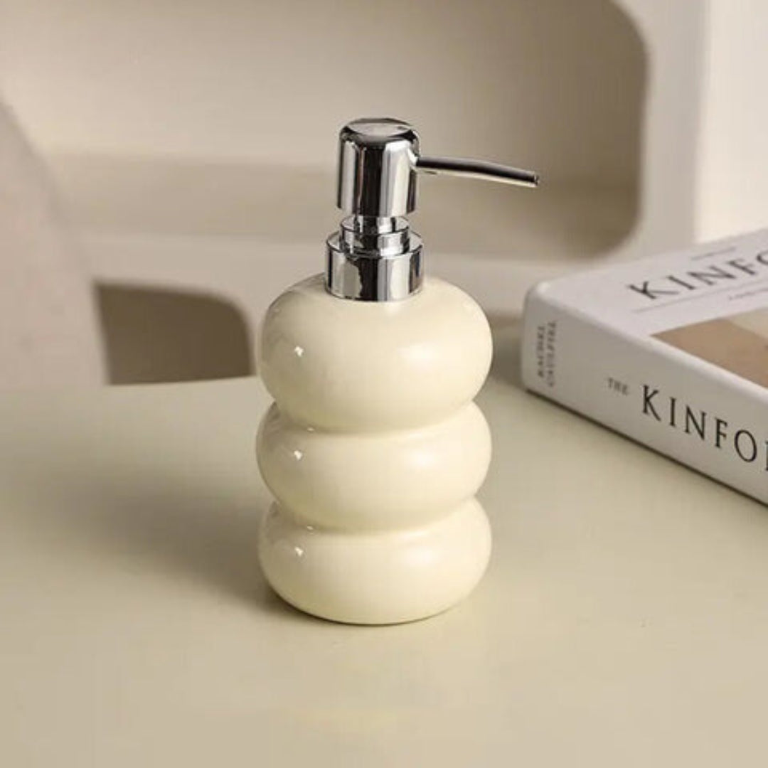 Ceramic dispenser with pump