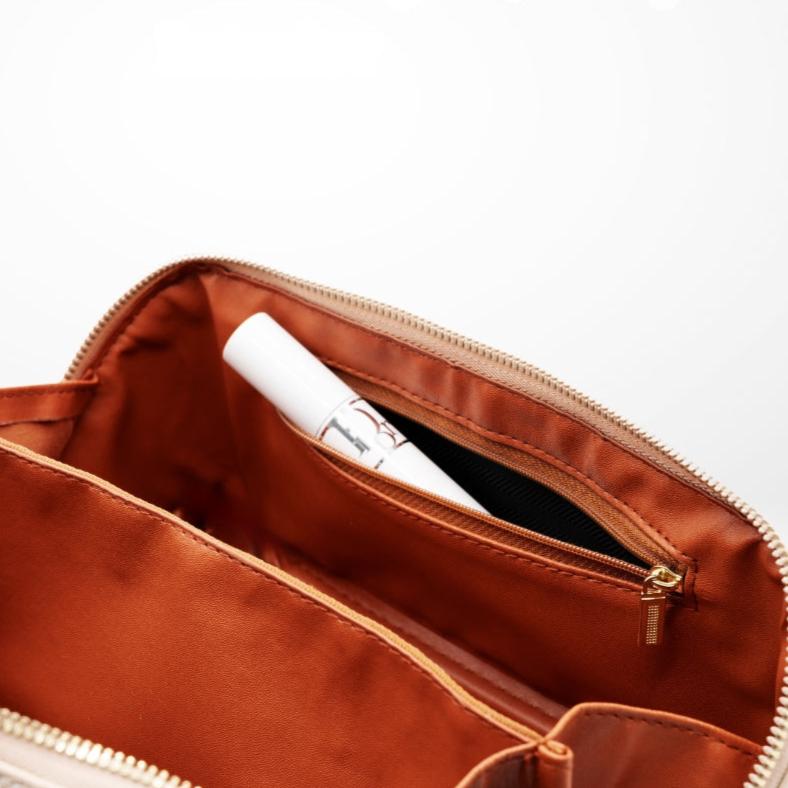 Emi - An elegant and compact makeup pouch.