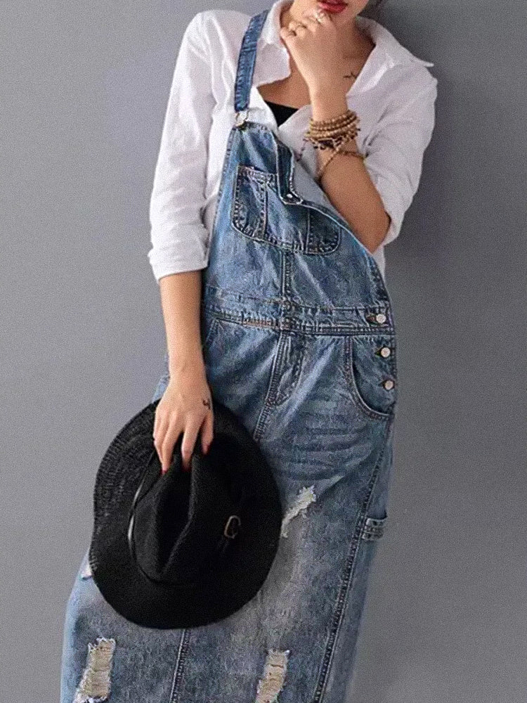 My Denim | A worn-out denim overall dress with a back slit