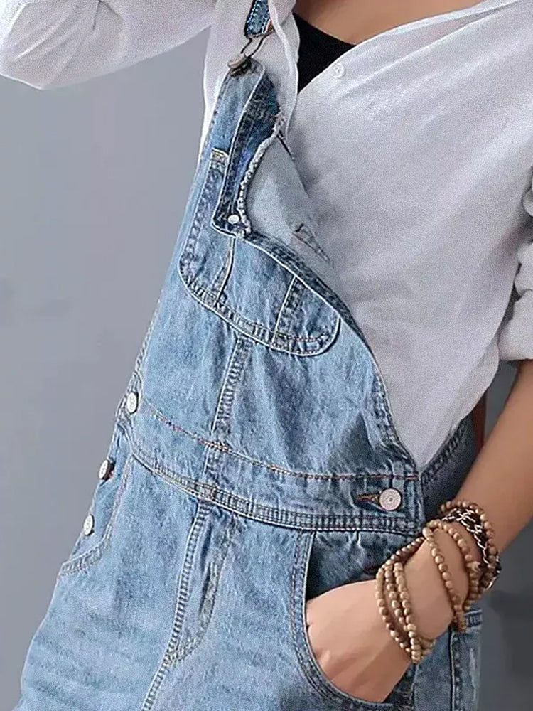 My Denim | A worn-out denim overall dress with a back slit