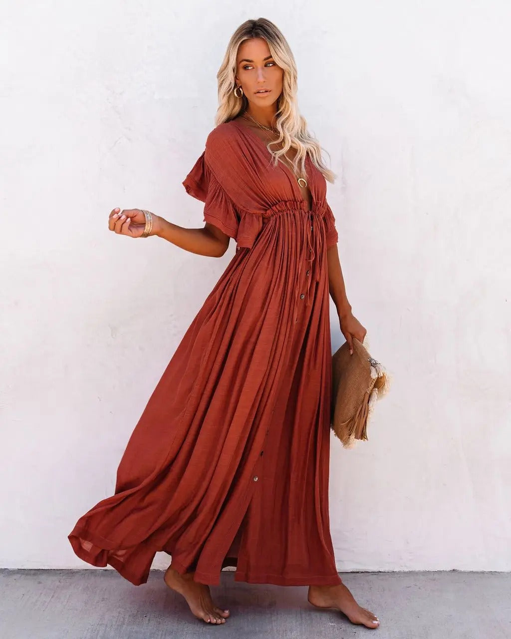 Noble - A loose maxi dress with ruffled sleeves and a pleated top