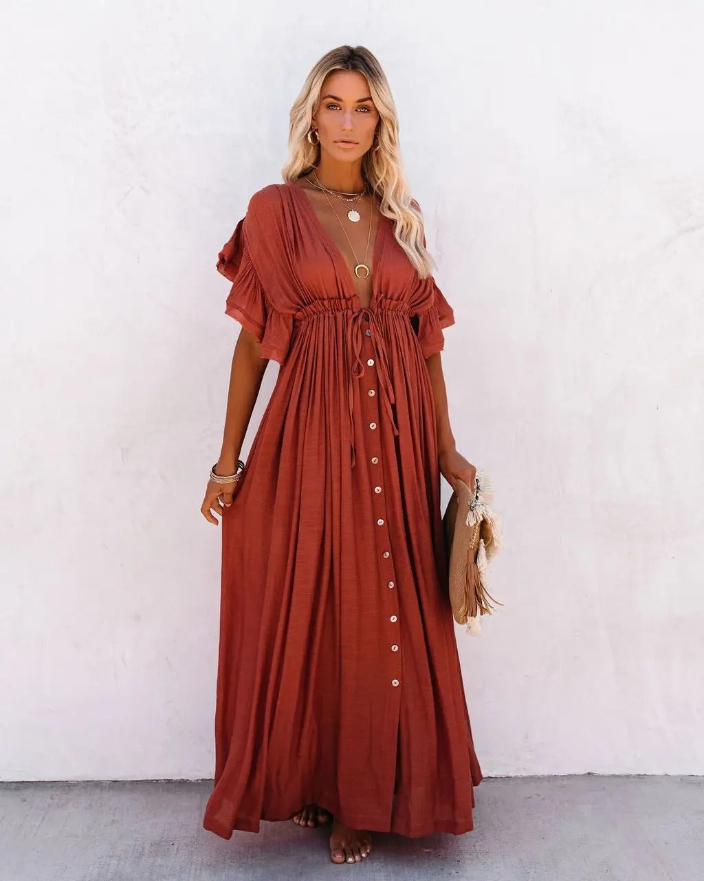 Noble - A loose maxi dress with ruffled sleeves and a pleated top