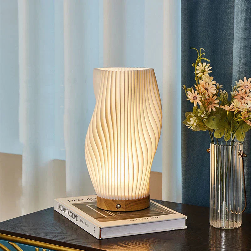 Bellarme - A reliable table lamp with a wavy shade design