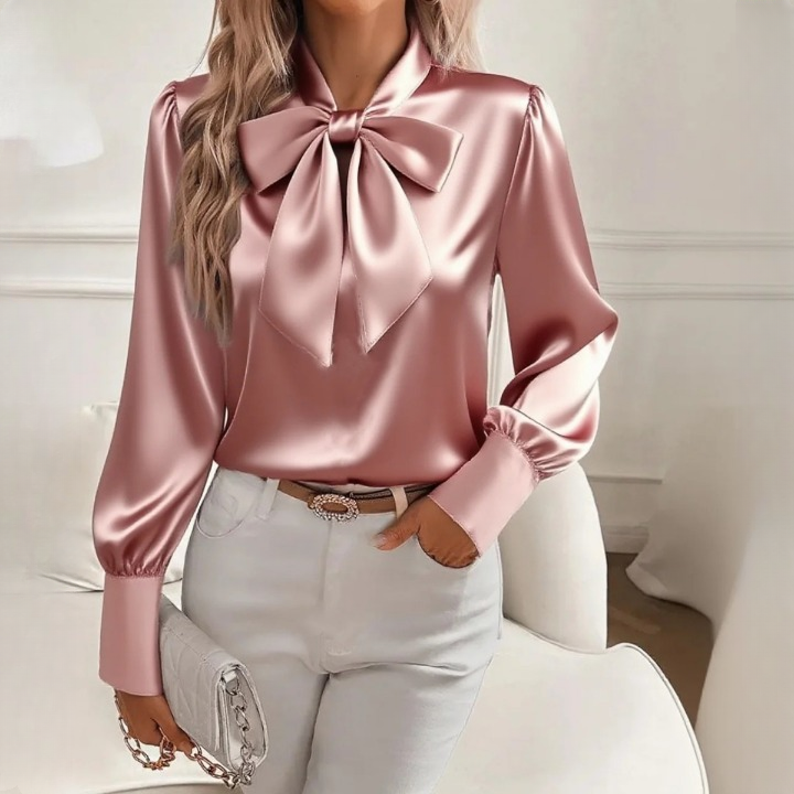 Billie - A chic blouse with trendy puff sleeves and a large ribbon.